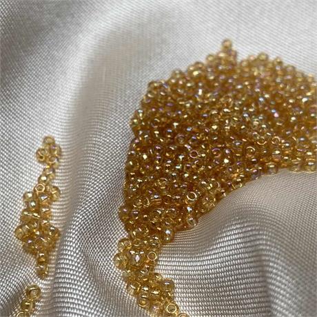 Toho Seed Beads - Transparent Rainbow Lt Topaz Image 1