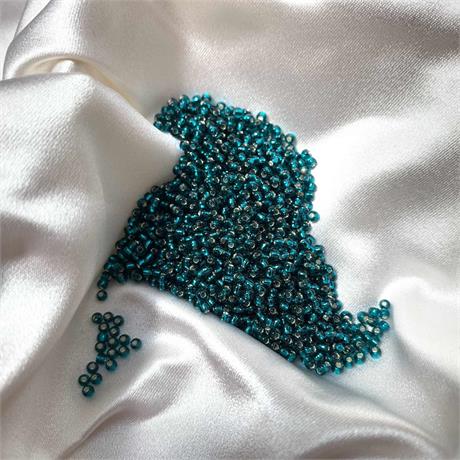Toho Seed Beads - Transparent Silver Lined Teal Image 1
